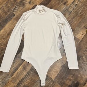 Cream Long-Sleeve Turtleneck One-Piece Bodysuit